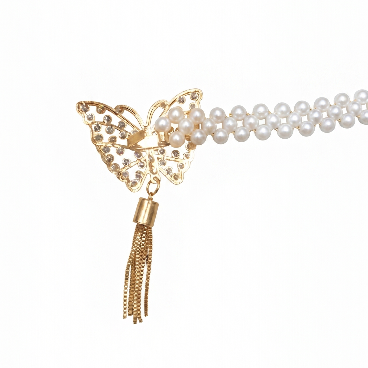 Close-up of a curtain tieback's gold butterfly set with crystals beside a double pearl bead chain