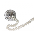 Angled view of a crystal curtain tieback medallion showing the pave surround and pearl bead chain