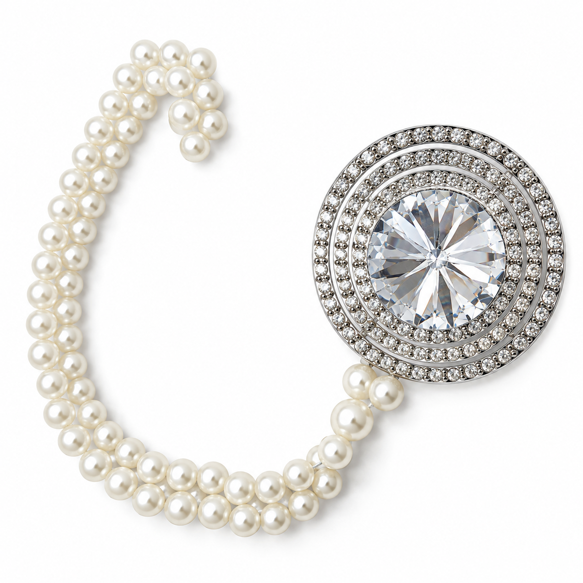Close-up of a curtain tieback's round crystal centerpiece  in a pave setting beside a double pearl chain
