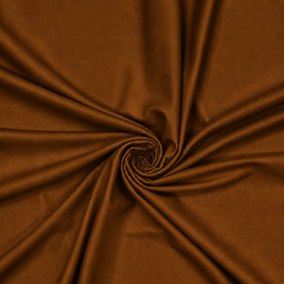 Dark brown plain velvet curtain fabric arranged in a swirl showing its rich drape
