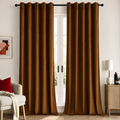 Dark brown velvet room-darkening curtains, set of 2, hanging floor length beside a window
