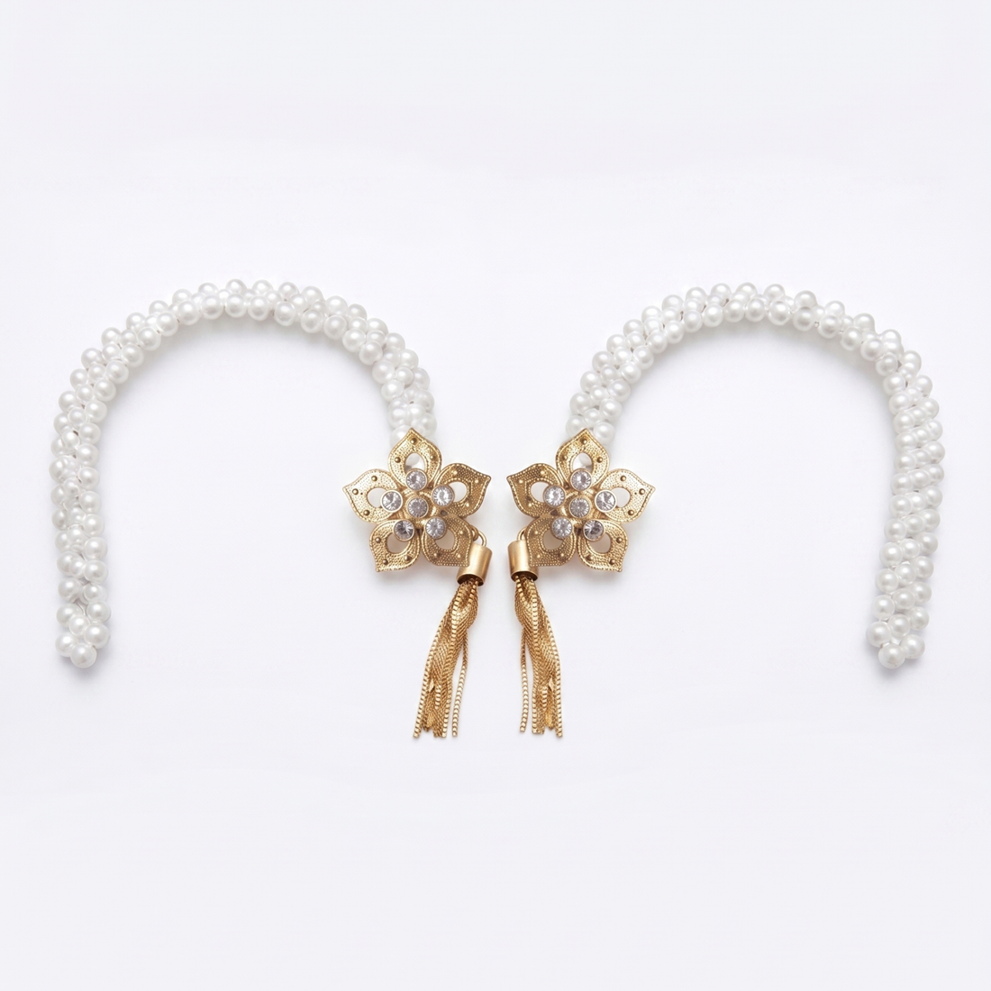 Two floral pearl curtain tiebacks on white, gold flower medallions with crystal center's and tassels