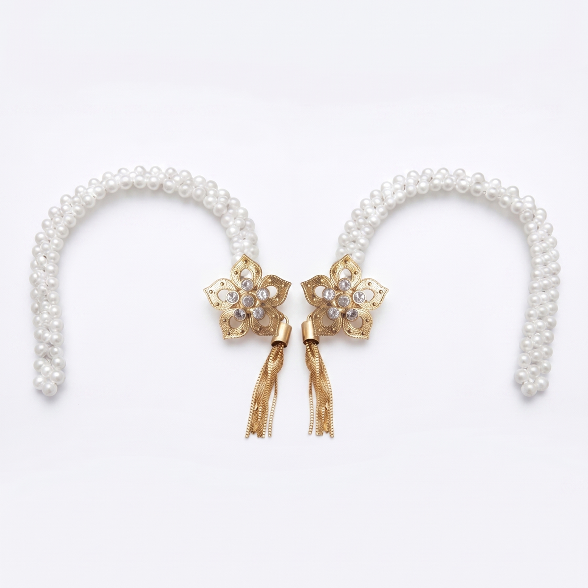 Two floral pearl curtain tiebacks on white, gold flower medallions with crystal center's and tassels