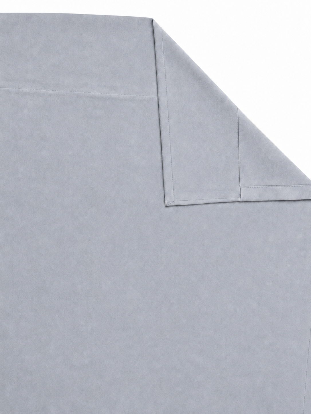 Grey velvet curtain panel laid flat with one corner folded to show the reverse side

