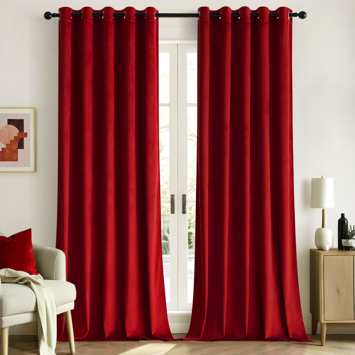 Maroon velvet room-darkening curtains, set of 2, hanging full length in a styled living room
